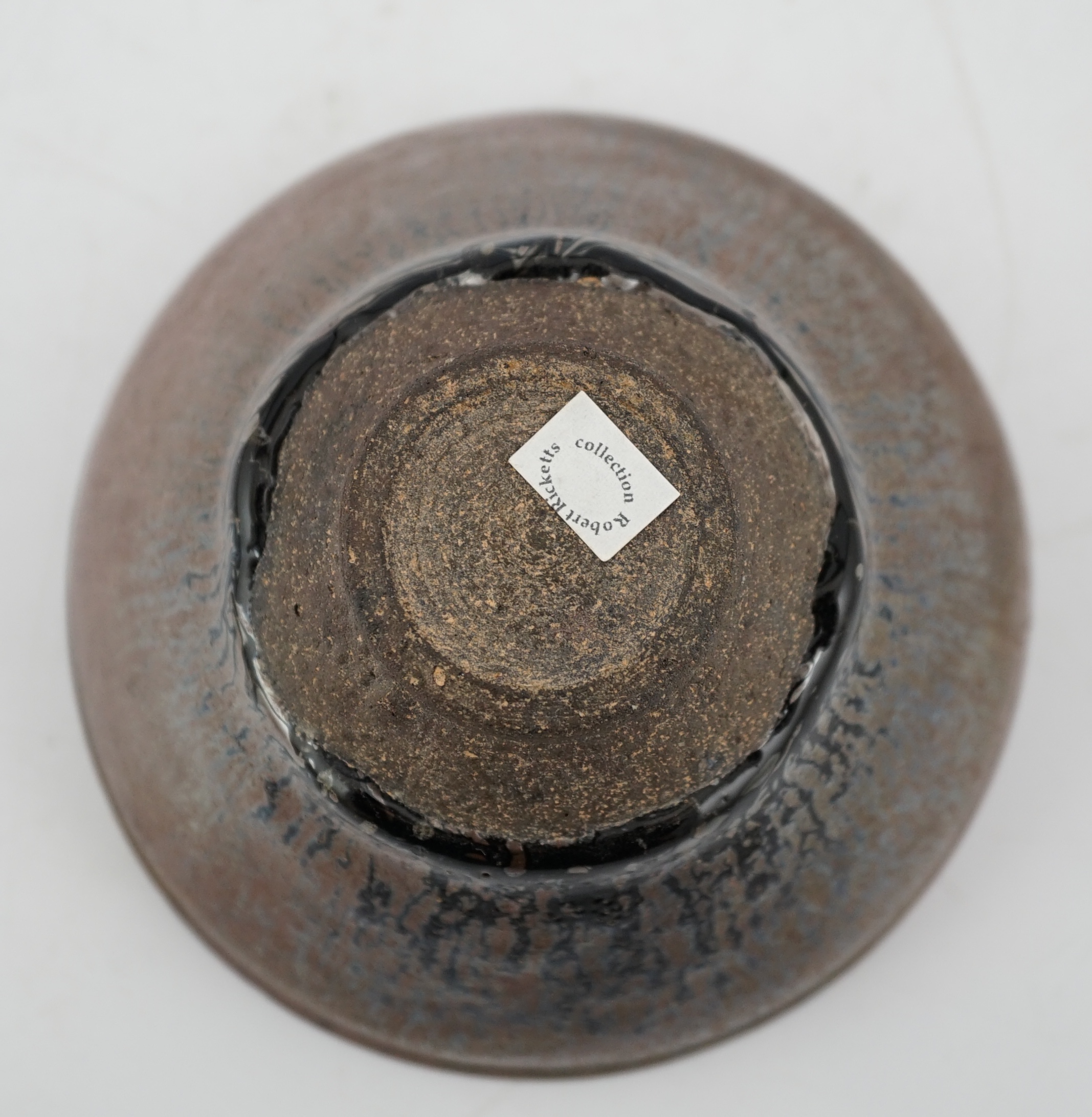 A Chinese 'hares fur' pottery bowl, Song Dynasty with a thick glaze pooling above the unglazed base, 12.2cm diameter. Provenance - Robert Ricketts collection. Condition - good